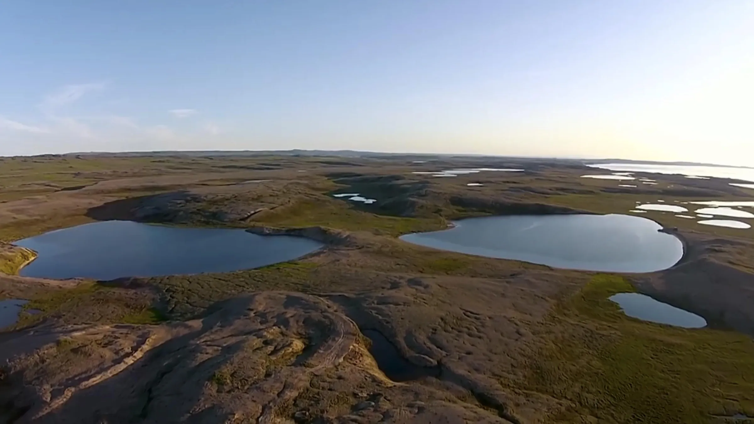 Aerial view of tundra and lakes across the Darnley Bay Project area